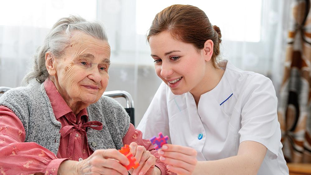 Elder woman with dementia and her carer